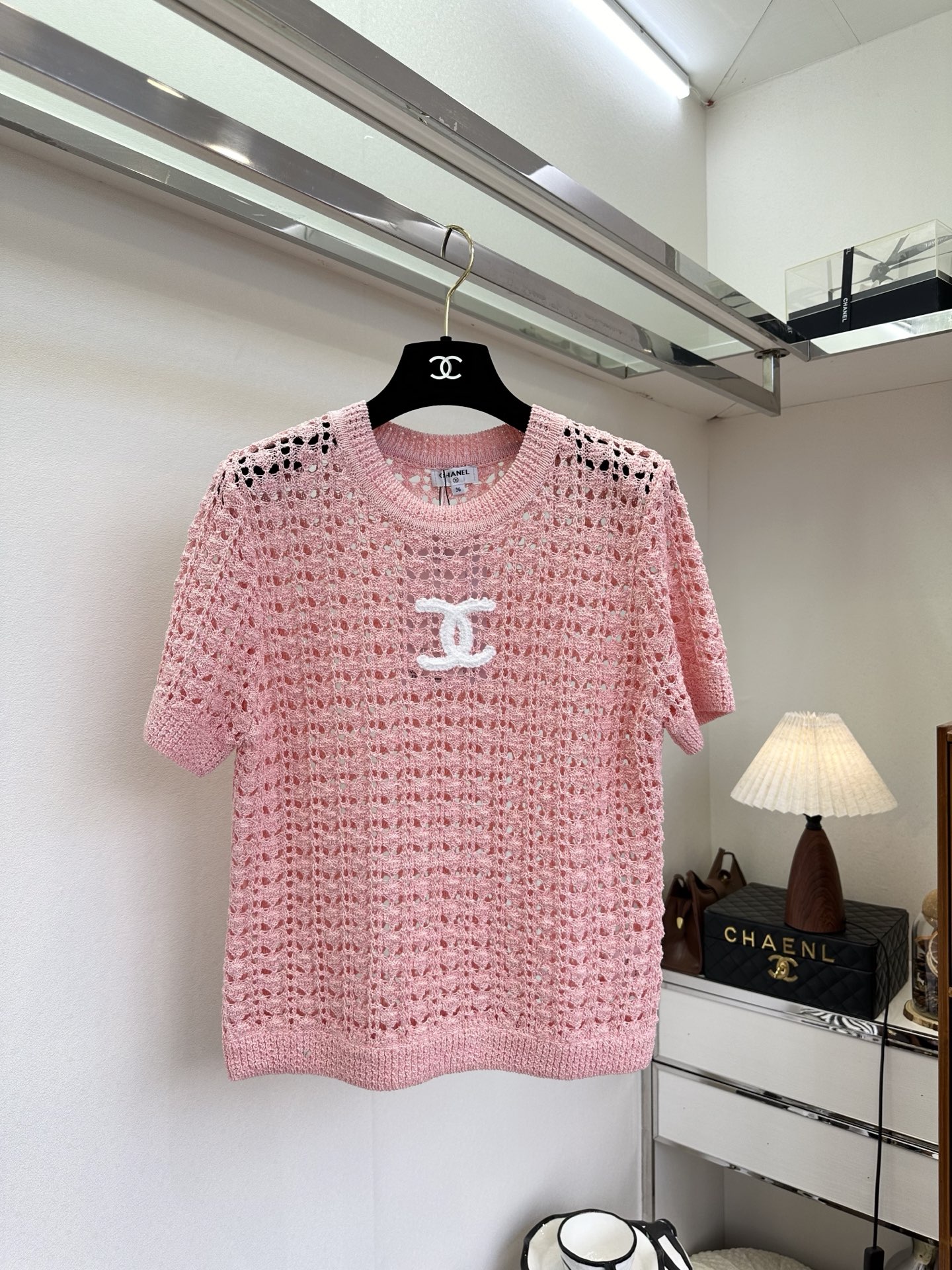 NO:721321,The highest version on the market, the girl will inspect the goods, trim the three marks on the threads, and ship the goods. You can post pictures and take videos. If you want quality or service, please add me on WeChat. We will not accept urgent orders. 26S French Hollow Knit Top  The soft and waxy knitted yarn creates a delicate mesh texture that gently fits the body shape and has a sense of breathing. The exquisite hollow details on the neckline echo the overall design, perfectly integrating the relaxed holiday atmosphere and Parisian elegance into one piece of clothing. Wearing it alone is cool and high-end, and layered with suspenders to add a bit of laziness and casualness. It is an indispensable atmospheric item in the spring and summer wardrobe. ●SIZE s m l●, Chanel - Clothing, chanel,19860909市面最高版本小妹验货、修剪线头上三标、发货可发图及拍视频,要品质要服务的加我微信,不接急单. 26S 法式镂空针织上衣 软糯的针织纱线织出细腻网眼肌理,轻柔贴合身形,自带呼吸感.精致的领口镂空细节呼应整体设计,把松弛的度假氛围和巴黎式的优雅妥帖地融在一件衣服里.单穿清冷高级,叠搭吊带又添几分慵懒随性,是春夏衣橱里不可缺少的氛围感单品. ●SIZE s m l●,香奈儿-服装,chanel,,Women's clothing