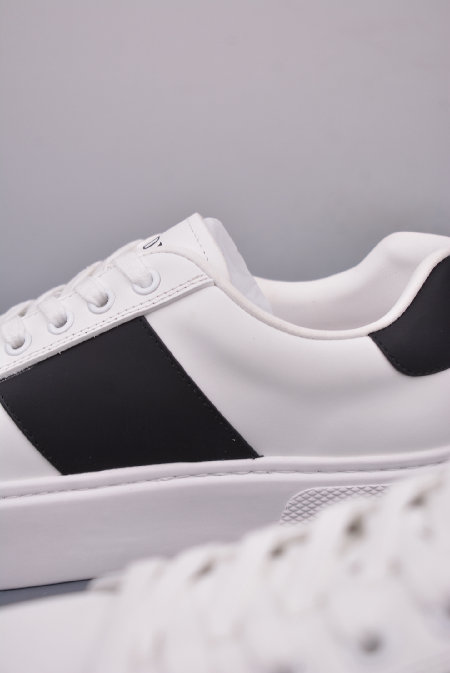 Prada Men's White Leather Low-Top Sneakers with Black Stripe Detail 8 i1746917496910 155 0 7