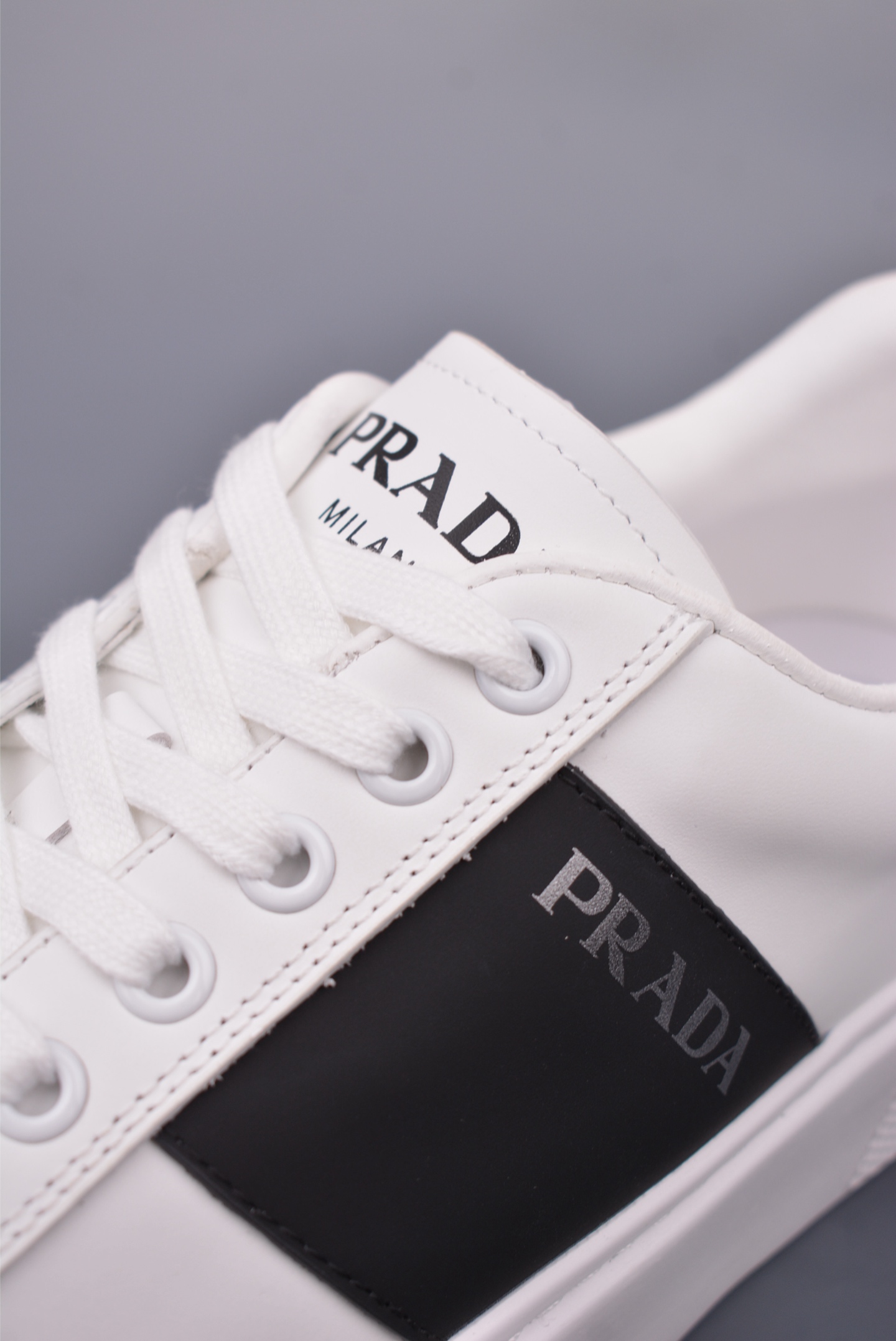 Prada Men's White Leather Low-Top Sneakers with Black Stripe Detail 7 i1746917498254 3895 0 6