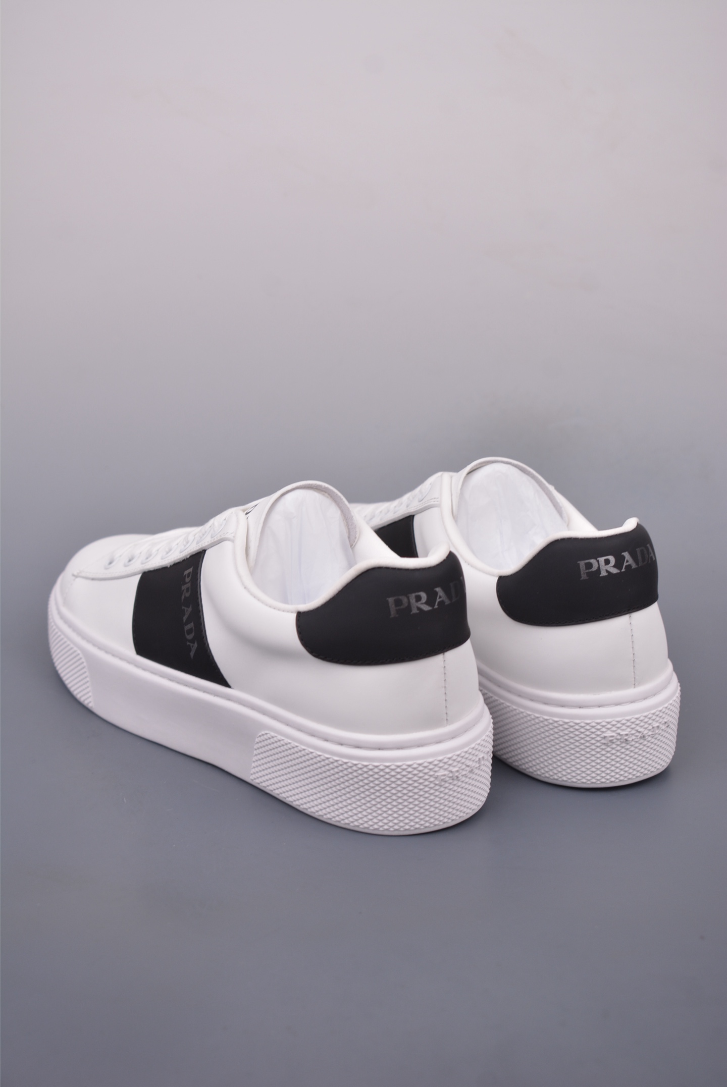 Prada Men's White Leather Low-Top Sneakers with Black Stripe Detail 2 i1746917498272 7552 0 1