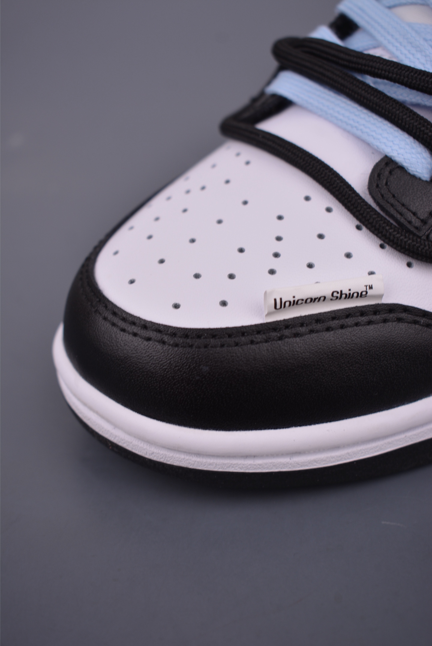 Nike SB Dunk Low Black White Blue with Embossed Design and Drawstring Laces 7 i1751149557349 6405 0 5