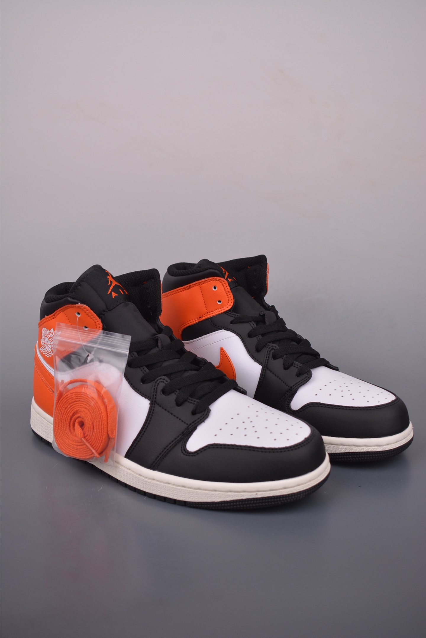 Air Jordan 1 Mid Black, White, and Orange - Fashionable Sneaker 2 i1759019974280 4035 0 0