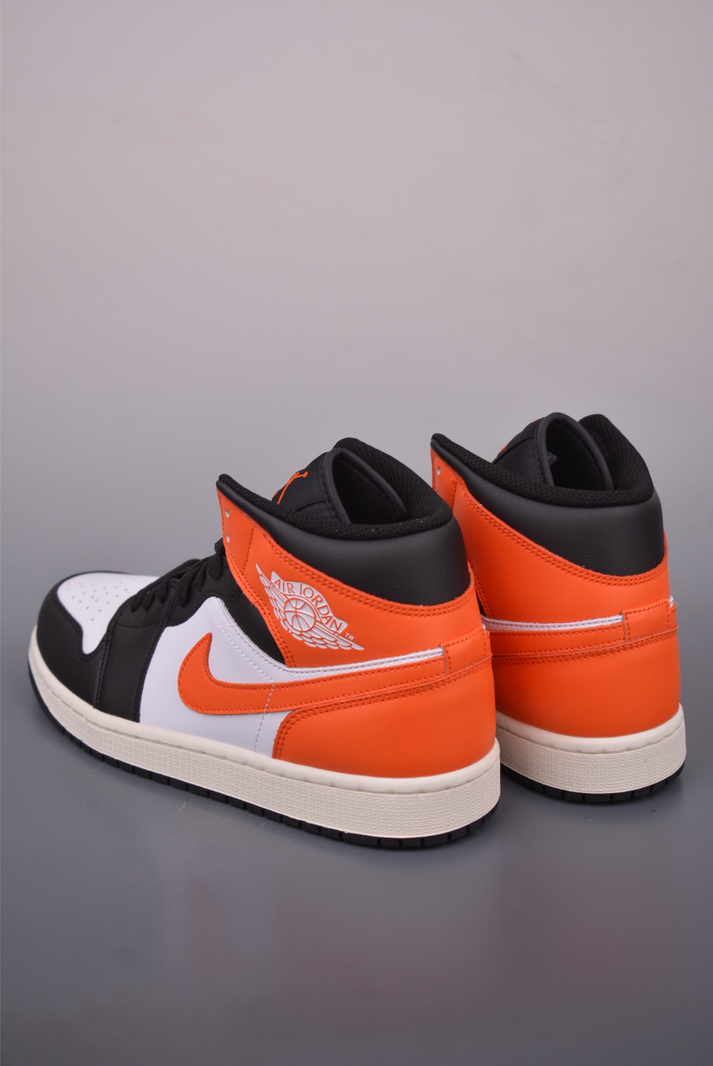 Air Jordan 1 Mid Black, White, and Orange - Fashionable Sneaker 3 i1759019974351 7676 0 1