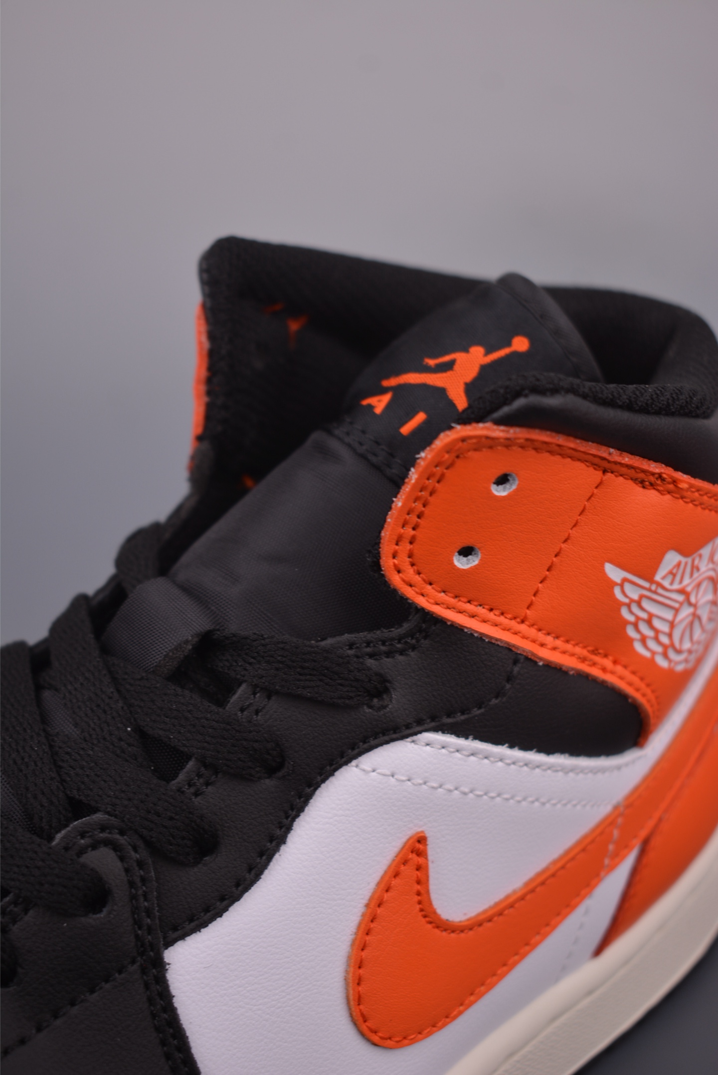 Air Jordan 1 Mid Black, White, and Orange - Fashionable Sneaker 8 i1759019976741 1941 0 6