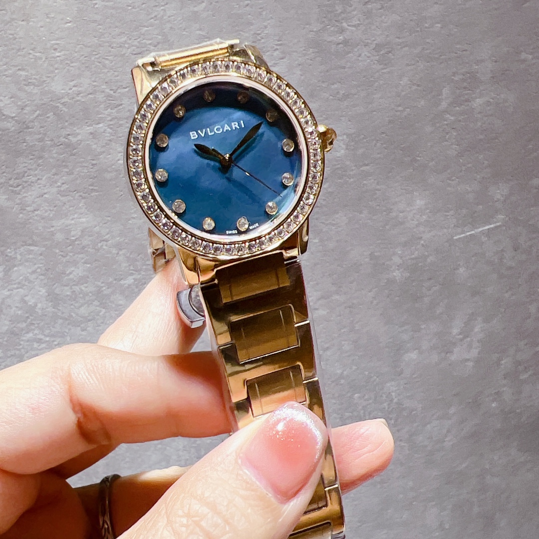 Bvlgari BVLGARI BVLGARI yellow gold case and bracelet, diamond bezel, blue mother-of-pearl dial 33mm Women's Quartz