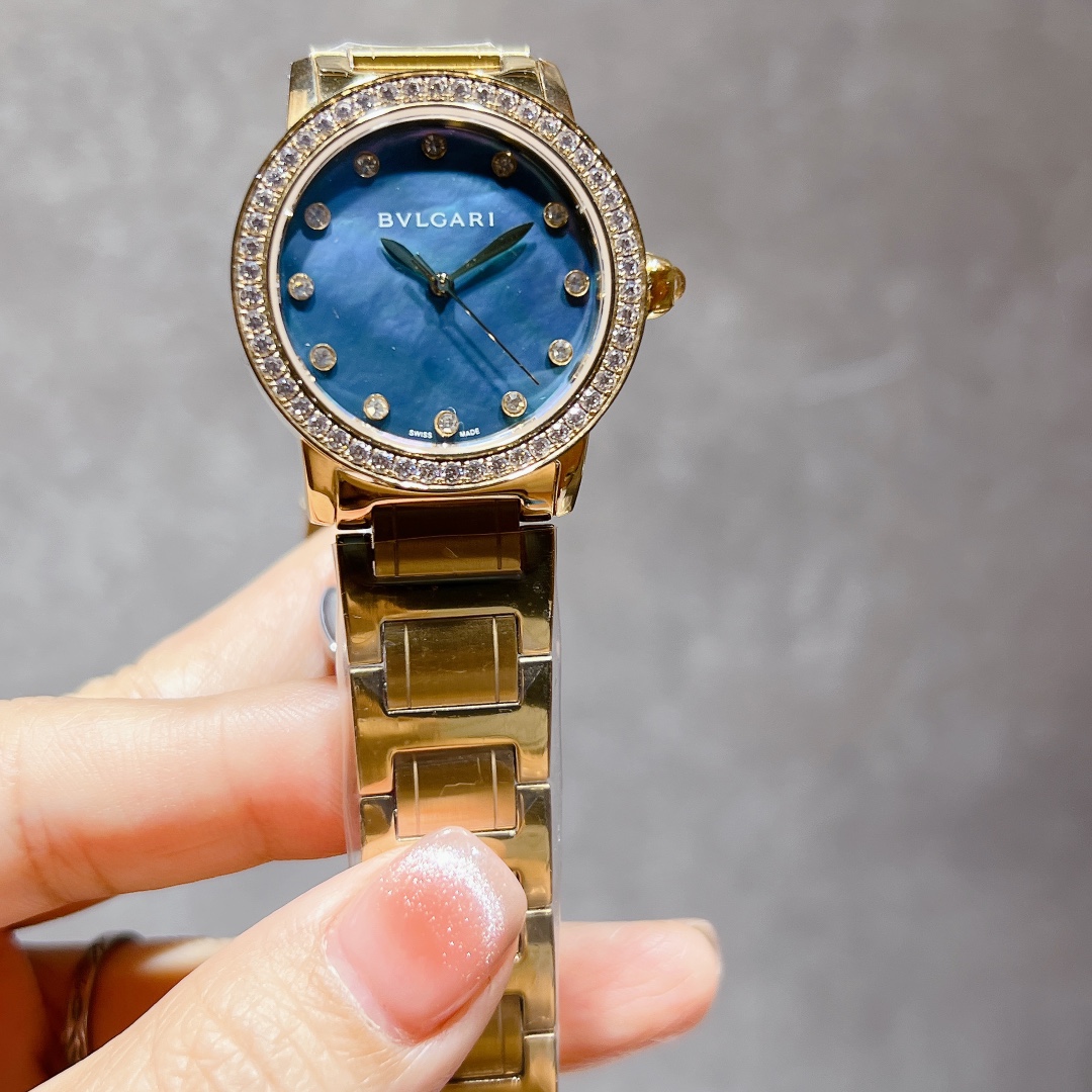 Bvlgari BVLGARI BVLGARI yellow gold case and bracelet, diamond bezel, blue mother-of-pearl dial 33mm Women's Quartz