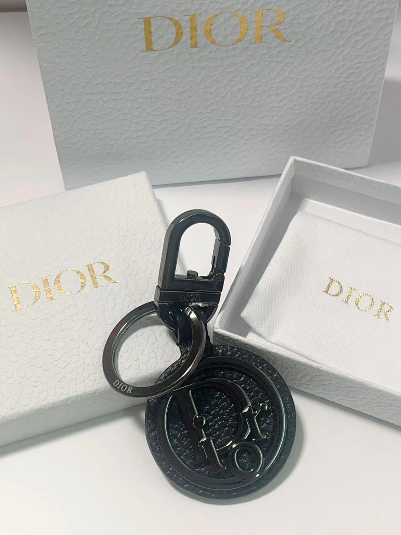 “CD Diamond Logo Key Button with Leather and Metal Details for Belts and Handbags”