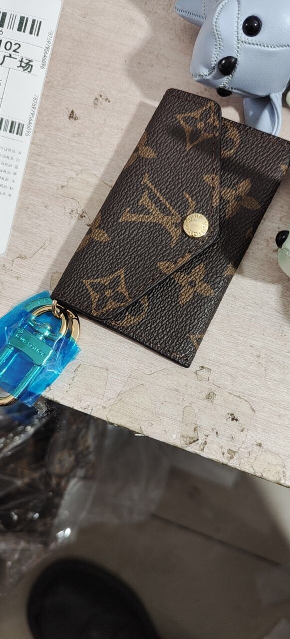 Leather Mini Envelope Wallet - Wallet Being Carried Wallet in hand