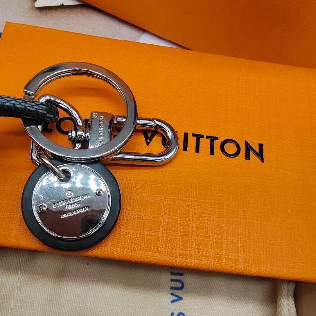 Close-up of keyring on leather keychain