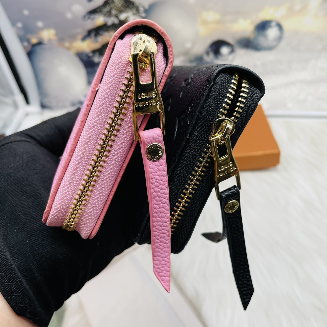 Embossed leather wallet in hand