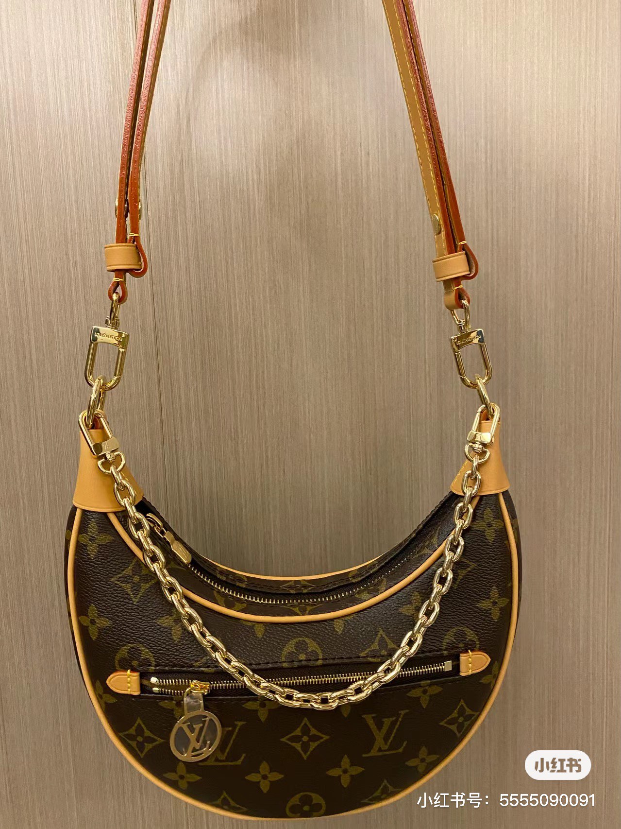 Leather crescent bag, side view