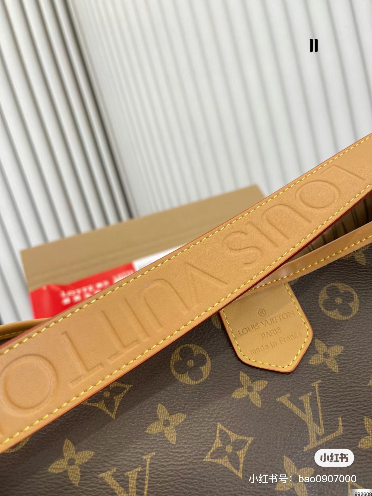 Side view of a premium leather crossbody bag