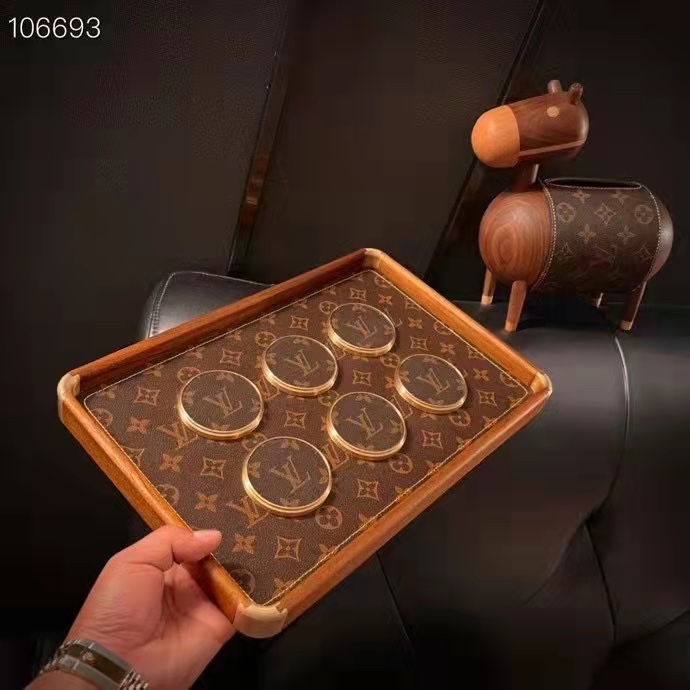 Top-down view of a set of six leather coasters.