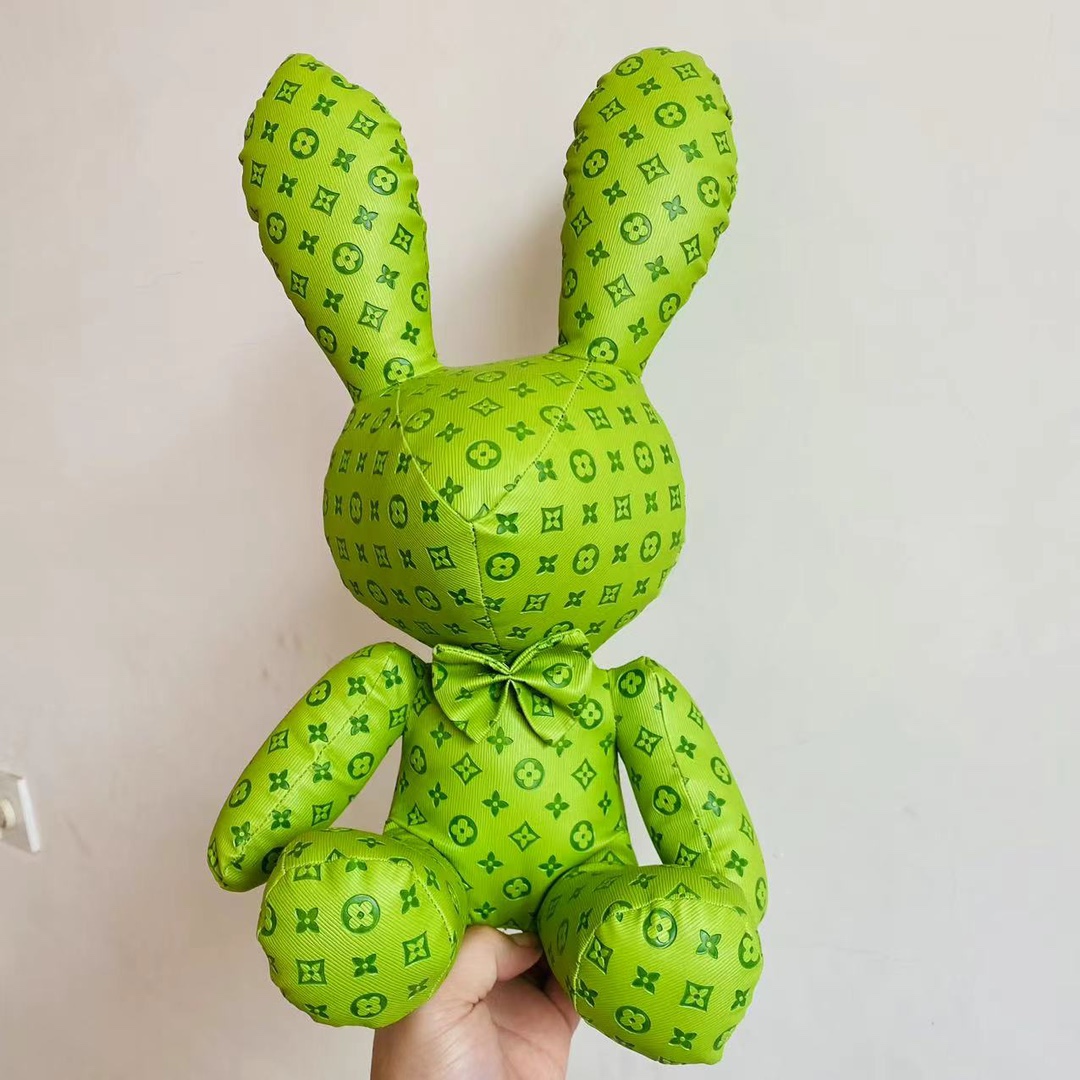 Woman carrying bulldog doll handbag