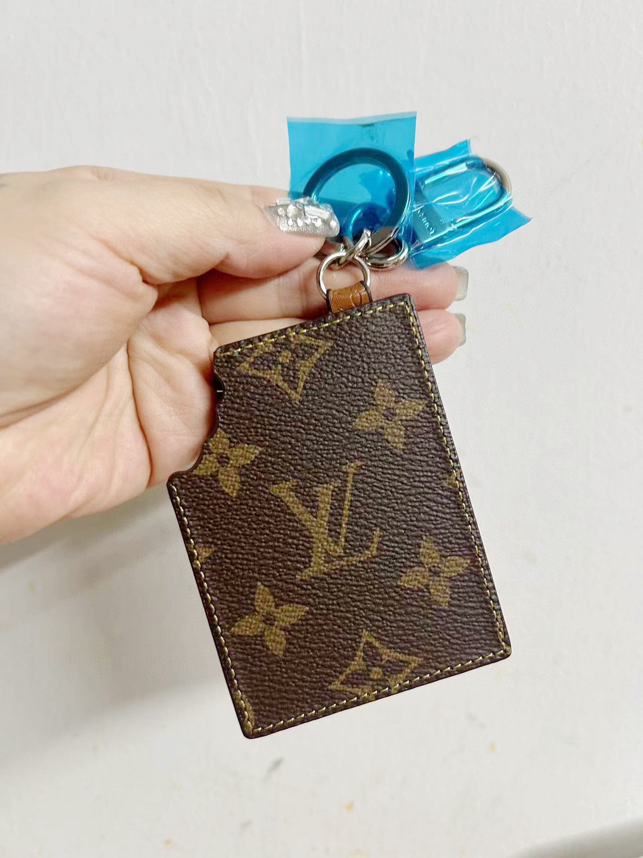 Keychain held by a person