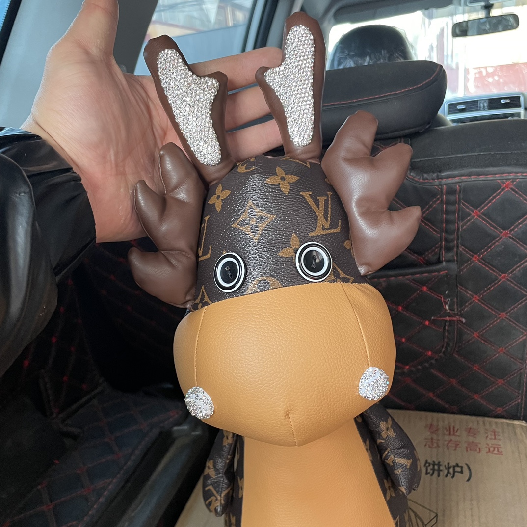 Bulldog handbag being held by a person, showing size