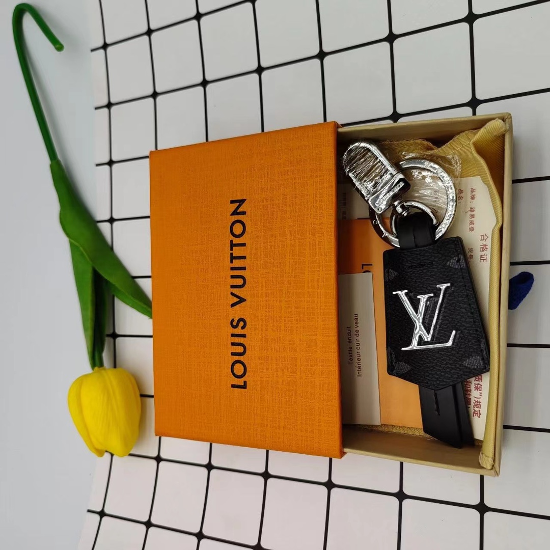Leather keychain with keys in hand