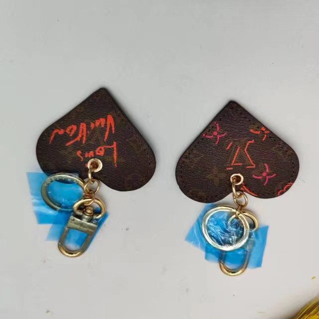 Leather heart keychain in use attached to bag