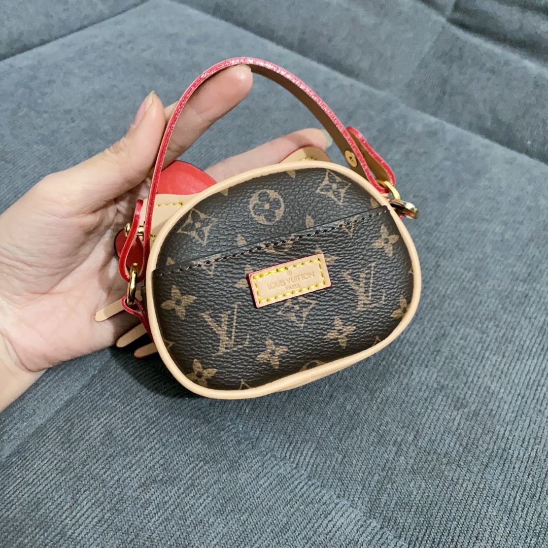 Model carrying the floral kt cat mini handbag 1