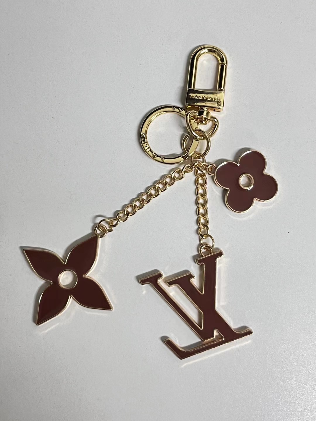 Close-up of metal flower keychain.
