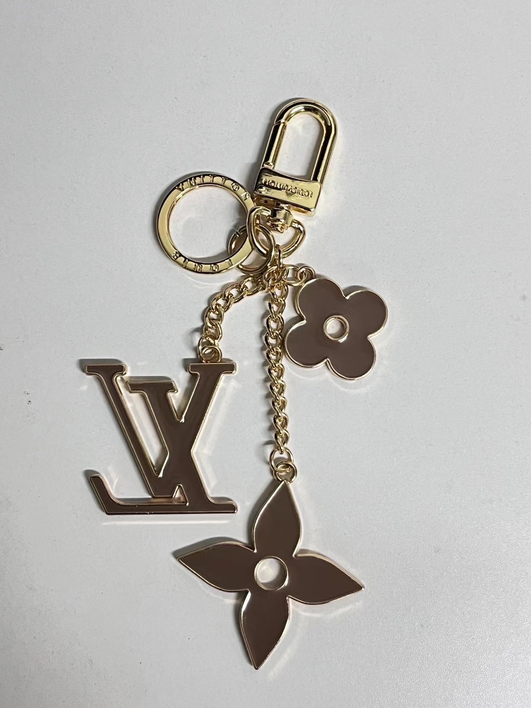 Metal flower keychain in use.