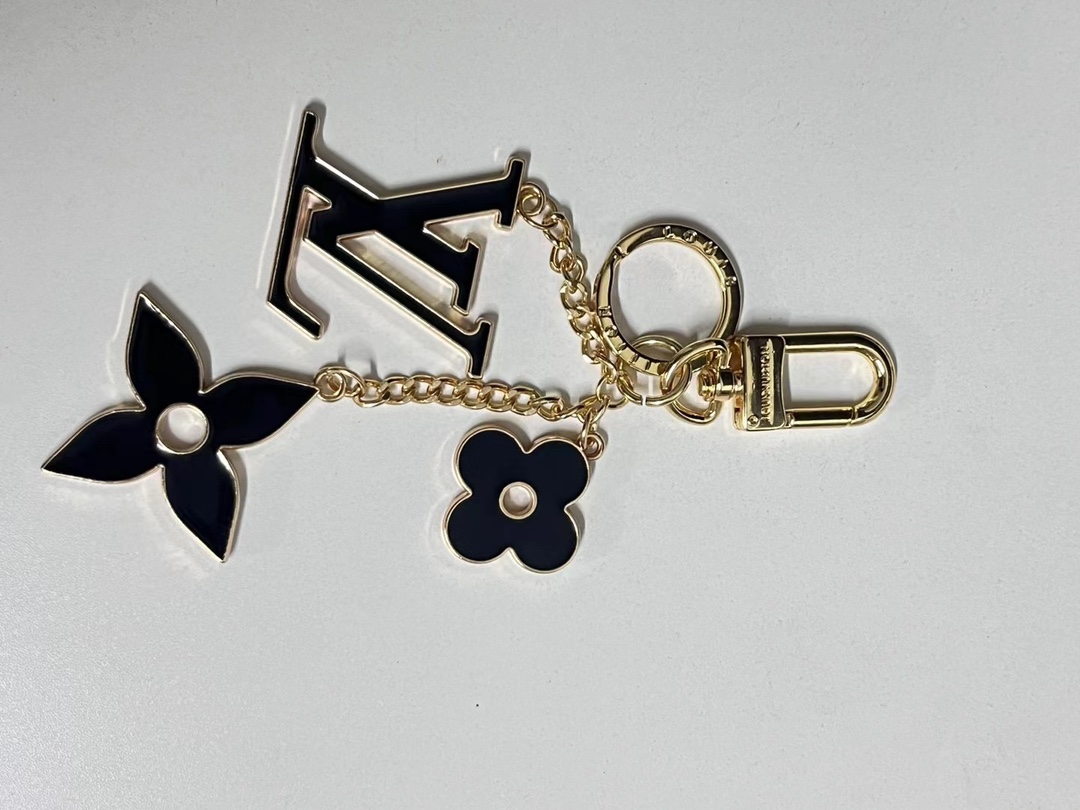 metal flower keychain close up.