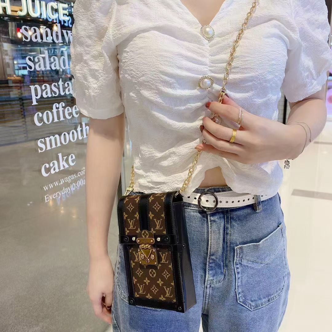Interior view of the chain crossbody phone bag, showing compartments