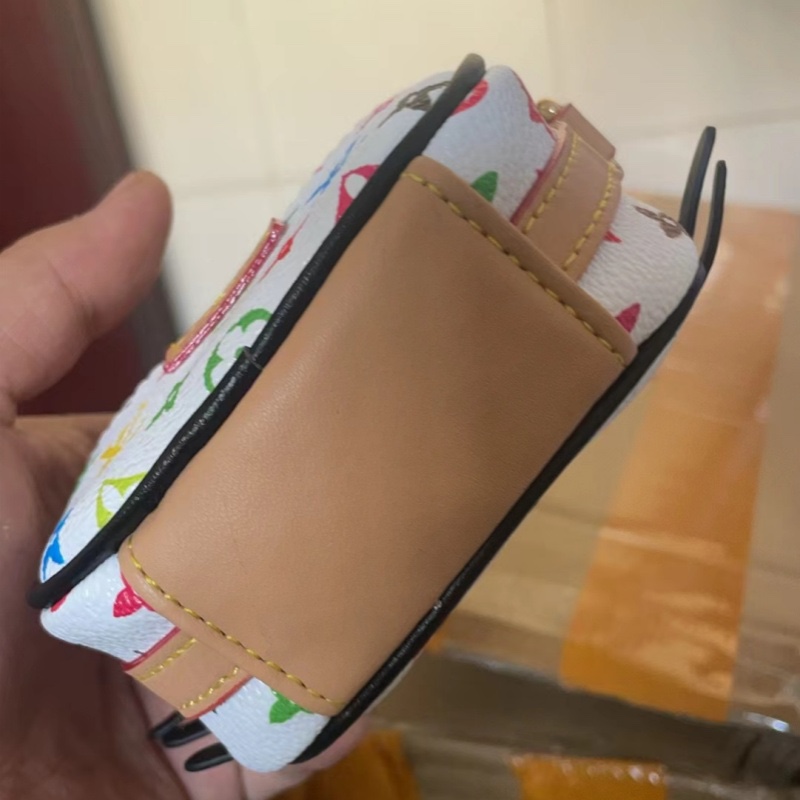 Angle View of floral kt cat mini handbag