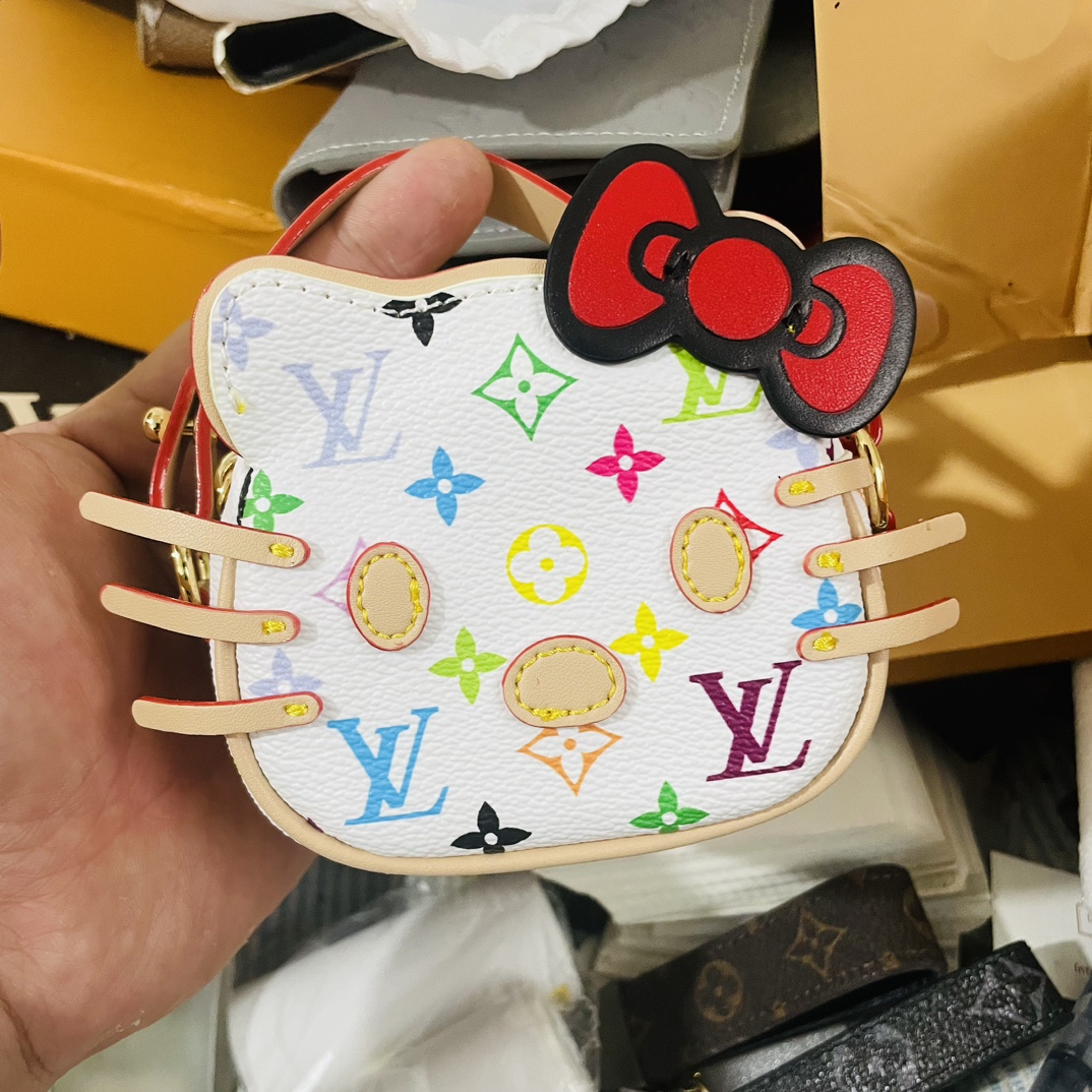 Side view of the floral kt cat mini handbag