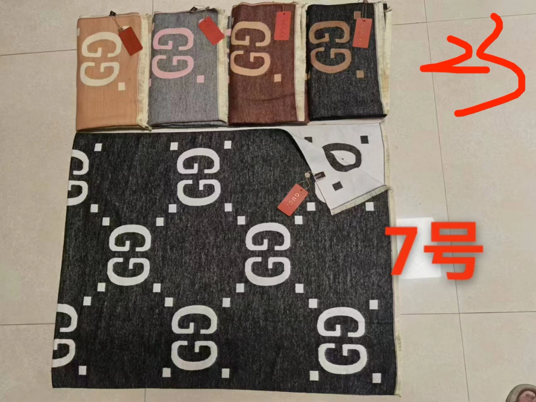 Display of various solid color scarves.