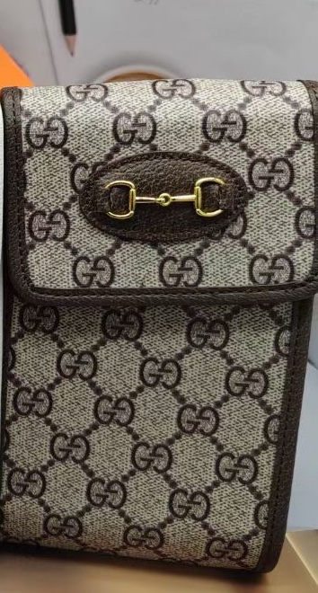 Close-up of chain strap detail on the phone bag