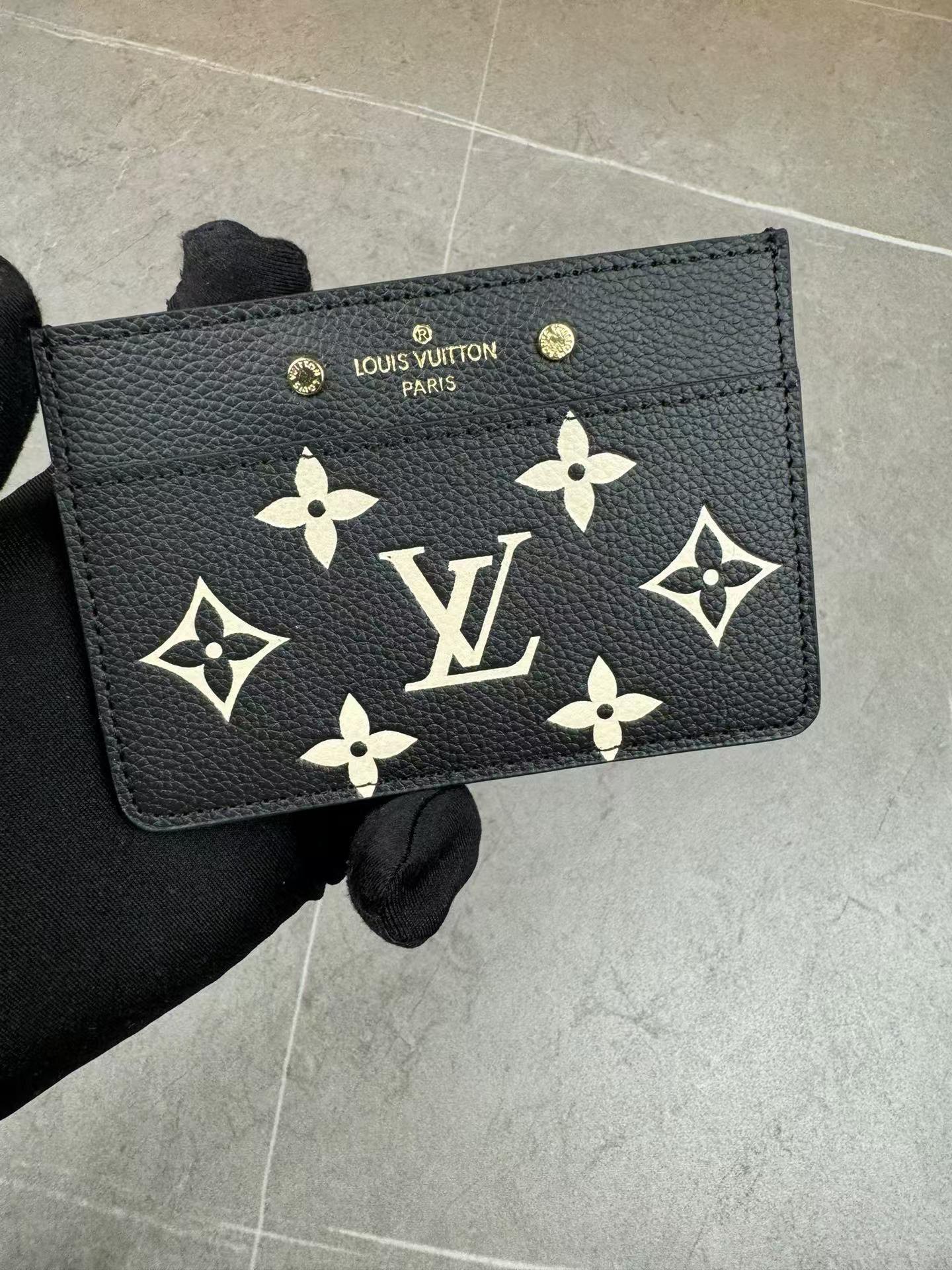Black and yellow leather card holder front view