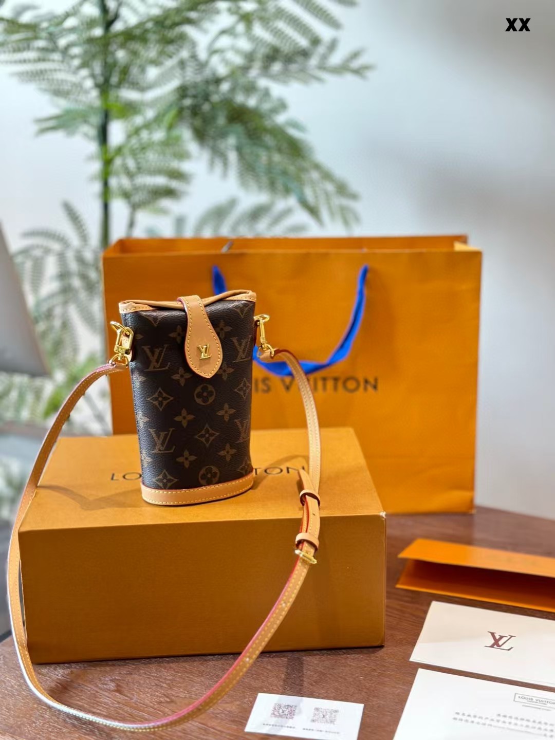Front view of a luxury leather crossbody bag