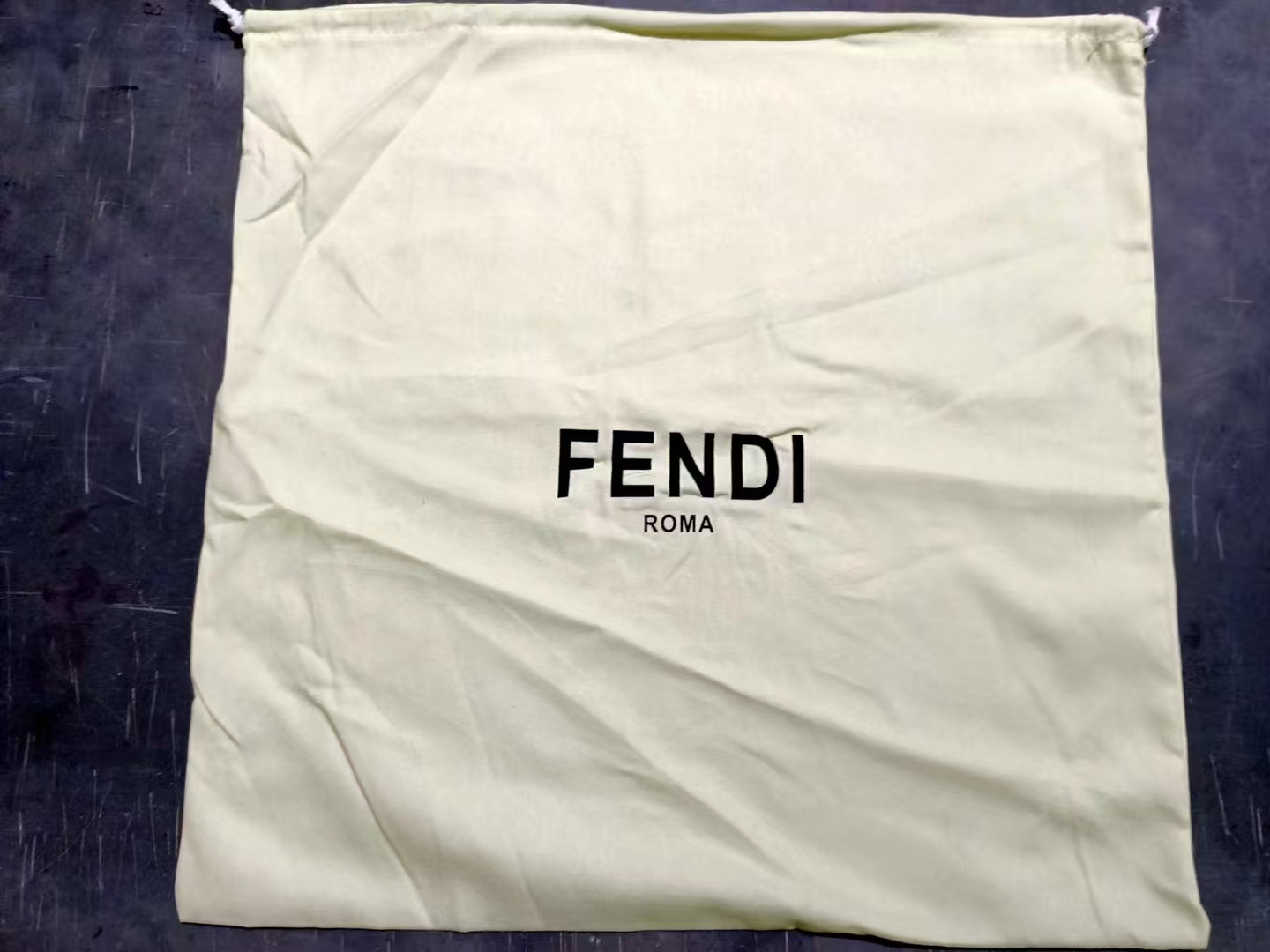 Dust Bag - Showcasing a Clutch in a Dust Bag A clutch handbag in a dust bag