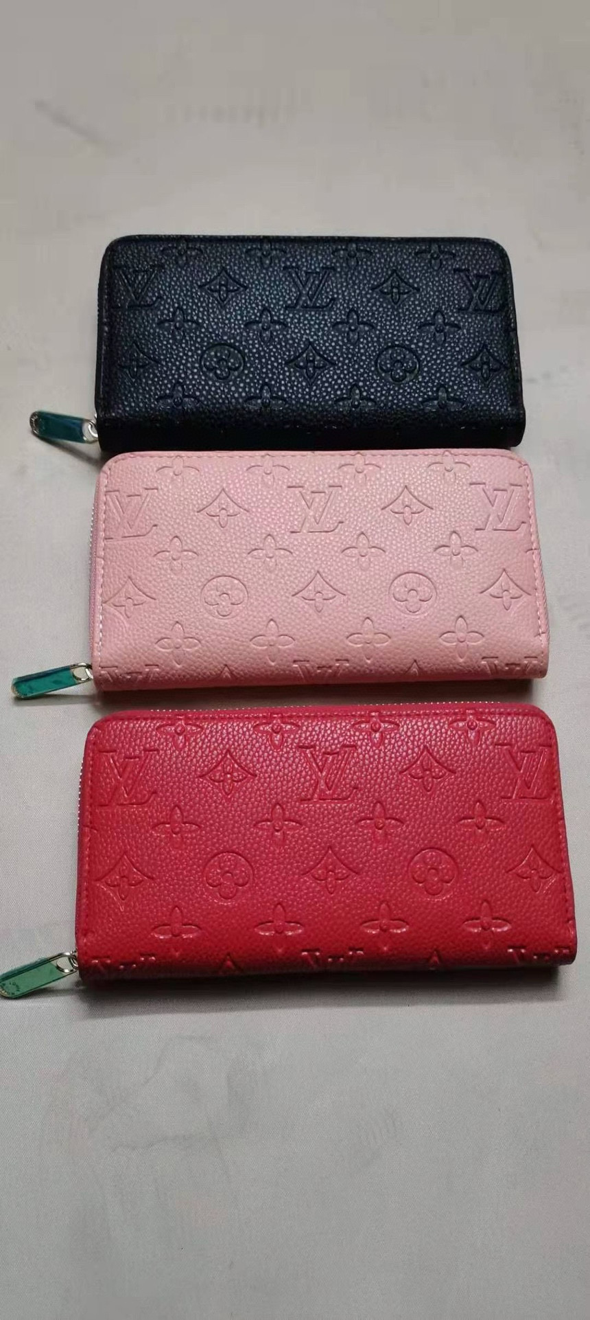 Close-up of elegant leather wallet with pressed flower detail