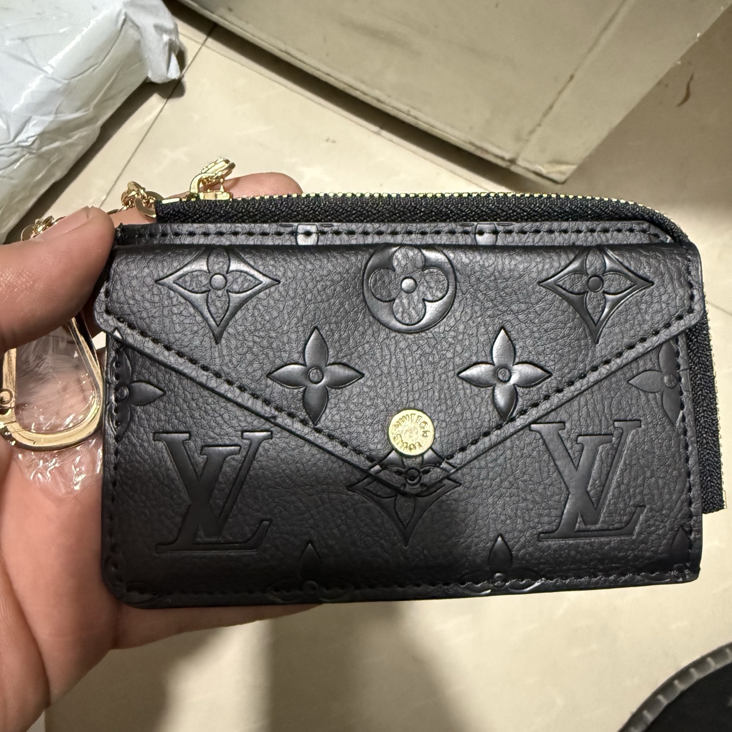 Back view of a black leather card holder