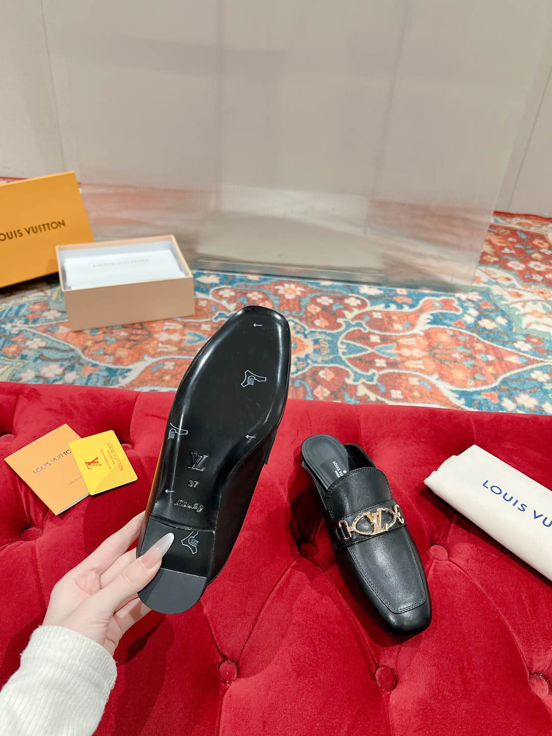 Louis Vuitton Black Leather Mule with Gold-Tone Chain Detail 9 i1735071031663 9240 0 5