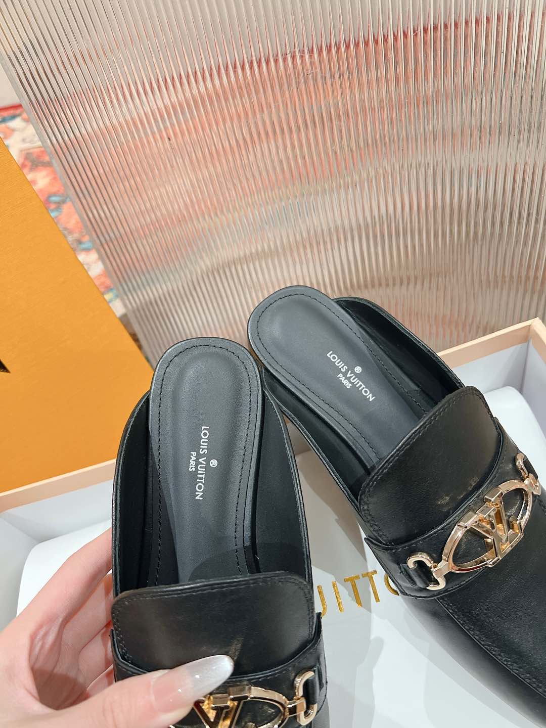 Louis Vuitton Black Leather Mule with Gold-Tone Chain Detail 7 i1735071031972 4219 0 8