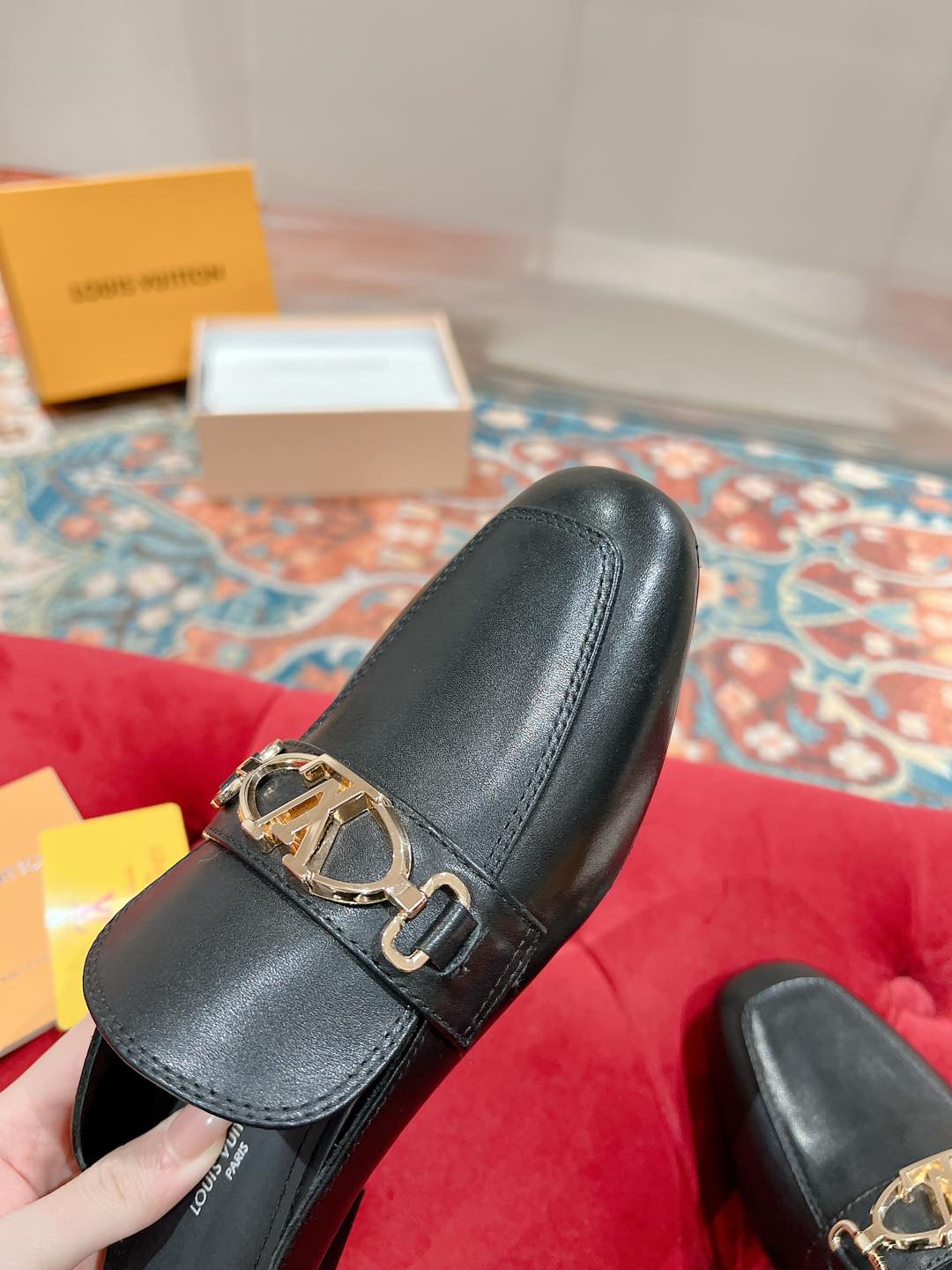 Louis Vuitton Black Leather Mule with Gold-Tone Chain Detail 8 i1735071032225 4925 0 3