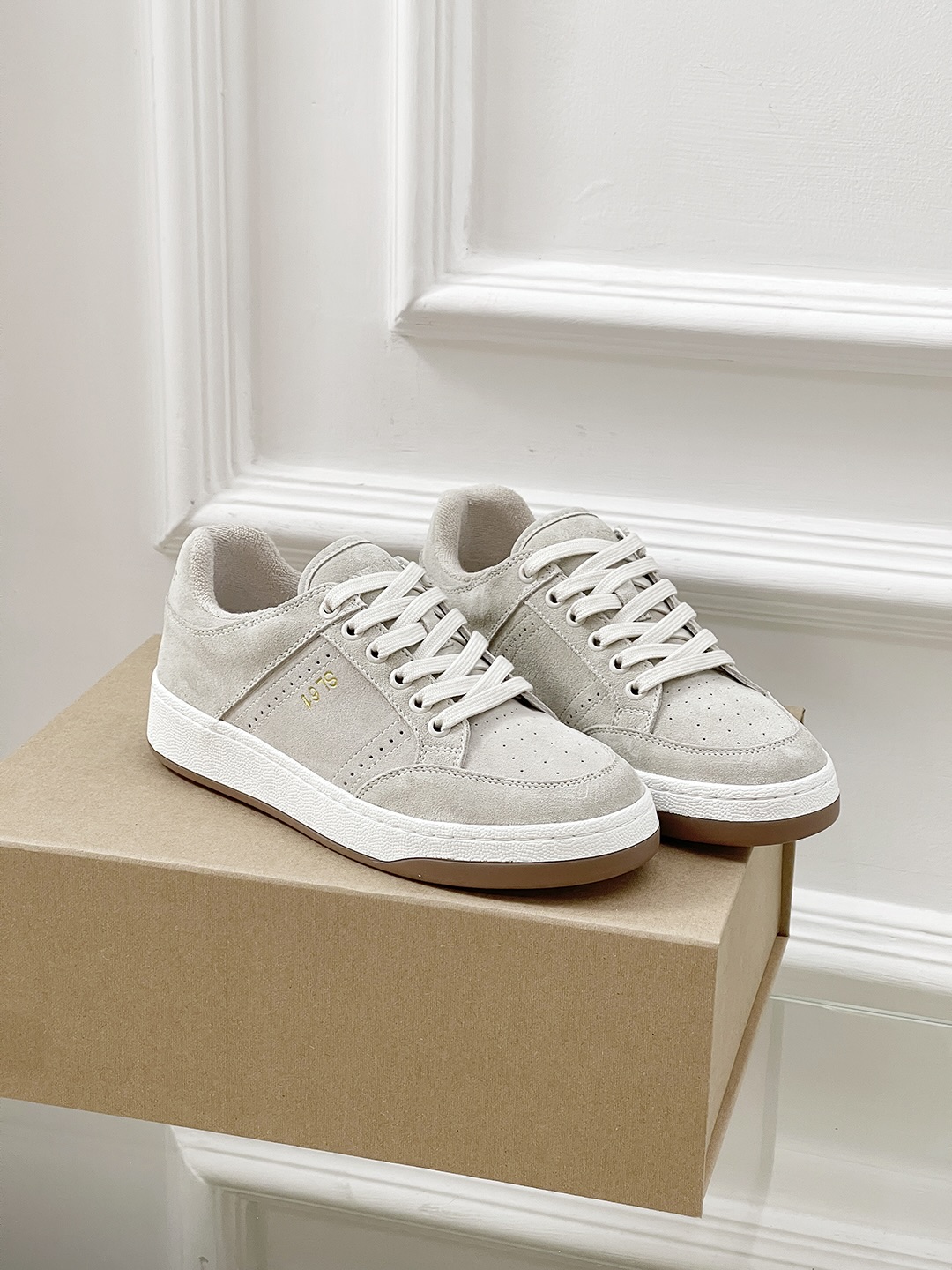 Fashion Trend: Saint Laurent’s White Sneakers Are the New Must-Have.
