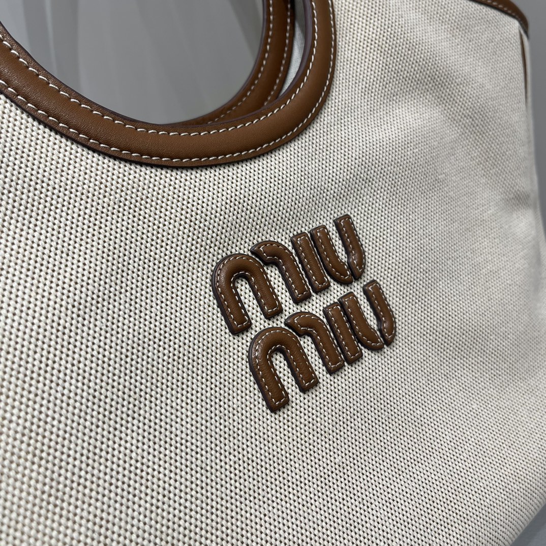 Miu Miu MiuMiu Isetan limited edition tote bag. New canvas fabric. Matched with top-grade imported calfskin. Carrying it every day on the street