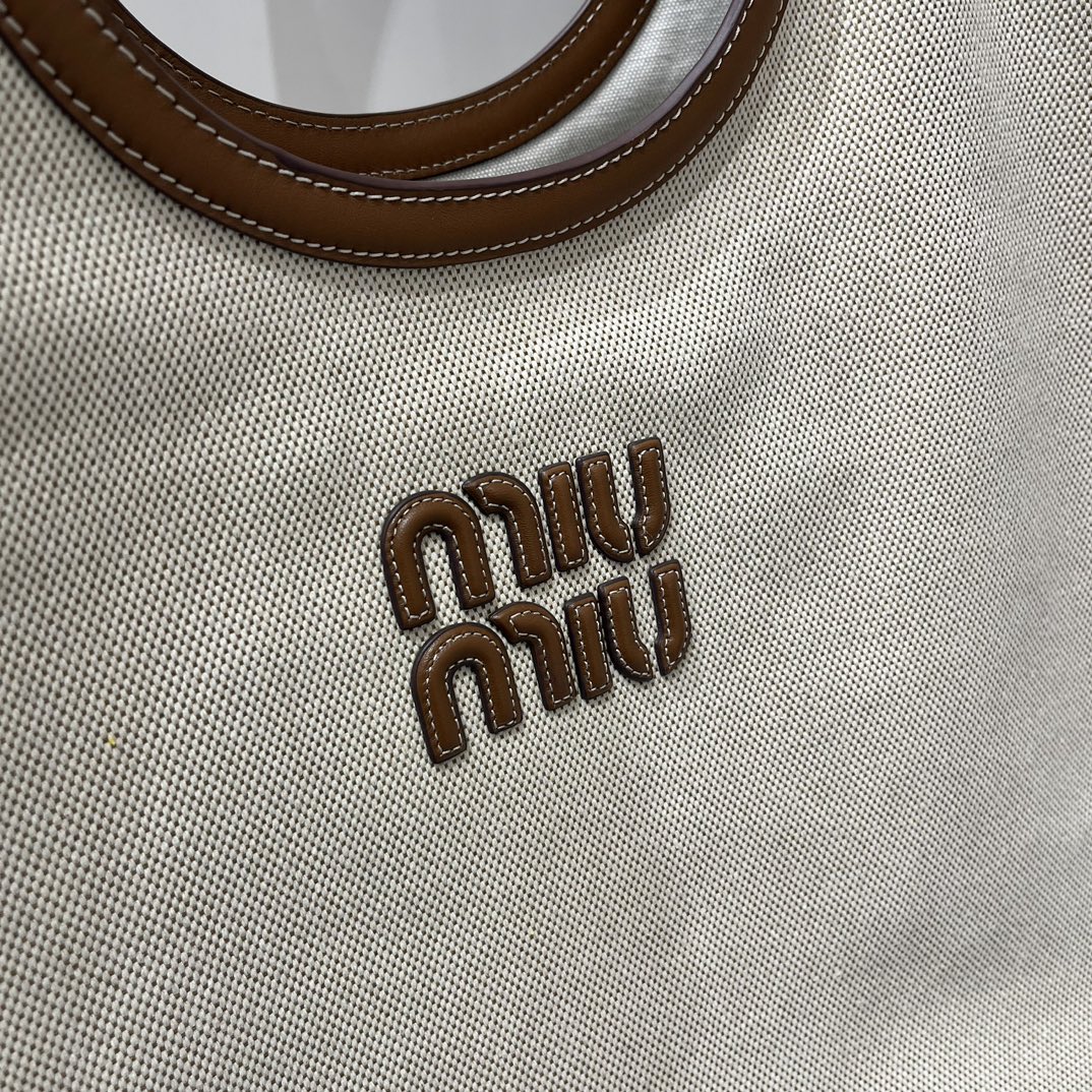 Miu Miu Large MiuMiu Isetan limited edition tote bag. New canvas fabric. Matched with top-grade imported calfskin. Carrying it on the street ever