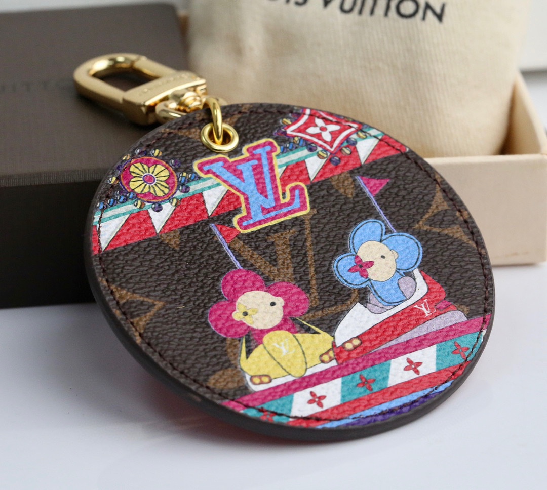 Bumper car keychain with a coffee-colored background, gold clasp, and a bumper car design.