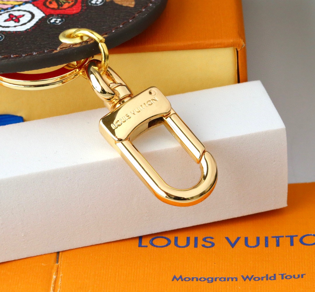 Leather carousel keychain attached to a handbag