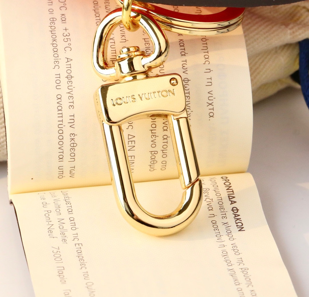 Cherry Blossom cat keychain shown attached to a set of keys.