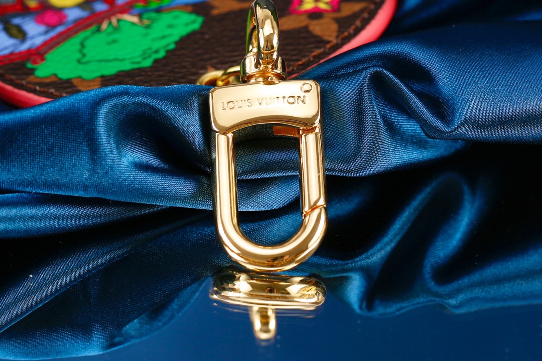 Leather kite keychain attached to a handbag
