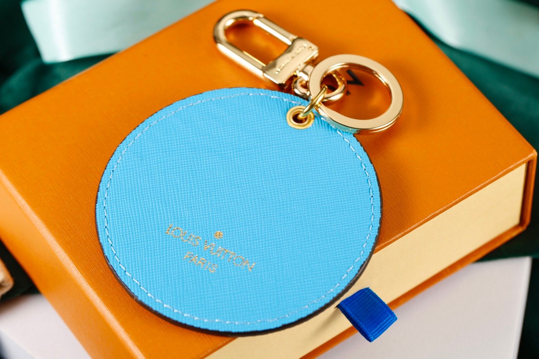 Close up of the sunny flower design on the leather keychain