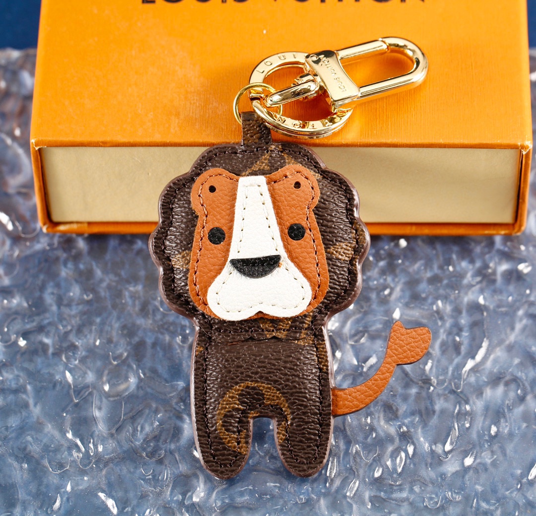 Close-up view of the coffee brown leather texture of the lion keychain