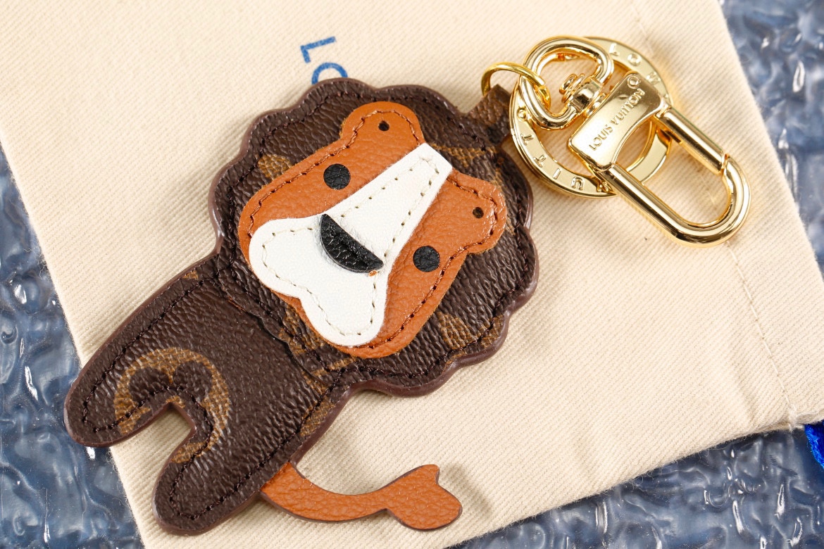 Side angle of coffee brown leather lion keychain