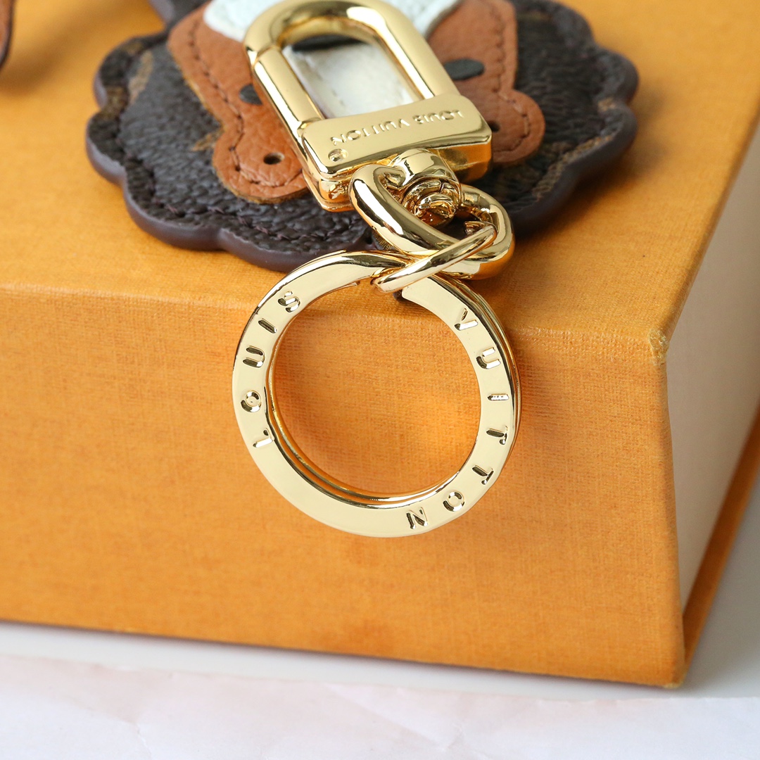 Back view of the coffee brown leather lion keychain